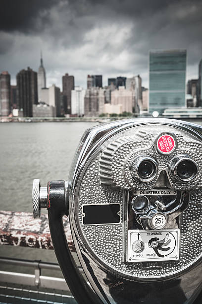 istock nyc skyline with binocular in the foreground 187089520