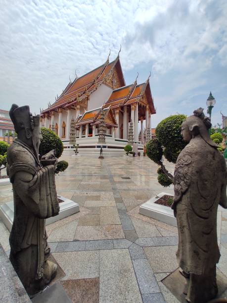 The main sanctuary at Wat Suthat Thepwararam in Bangkok, THAILAND. The main sanctuary and stone carving china doll in Wat Suthat Thepwararam. It is a royal temple of the first grade. antique chinese dolls pictures stock pictures, royalty-free photos & images
