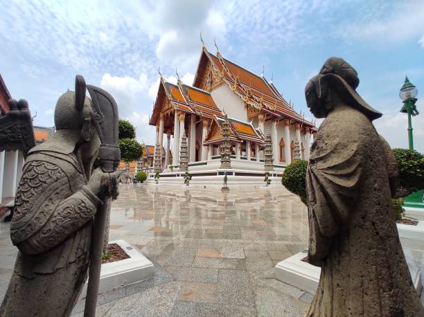 The main sanctuary at Wat Suthat Thepwararam in Bangkok, THAILAND. The main sanctuary and stone carving china doll in Wat Suthat Thepwararam. It is a royal temple of the first grade. antique chinese dolls pictures stock pictures, royalty-free photos & images