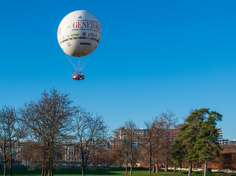 Paris, France - 12 17 2023 : the Generali hot air balloon in the André Citroën park in Paris