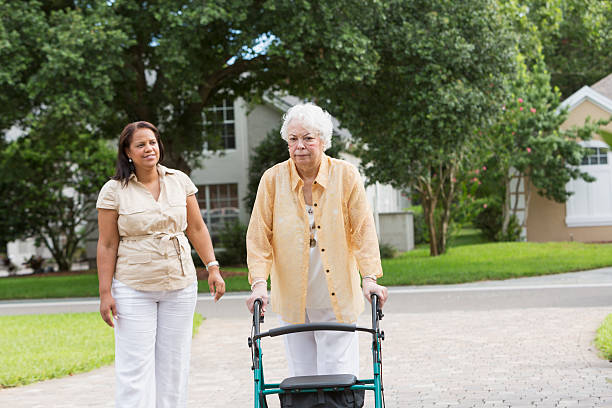 istock Senior woman with caregiver 187091869