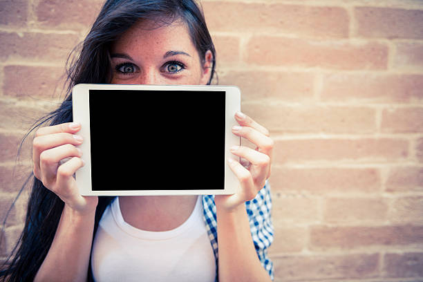 Young woman with her digital tablet stock photo