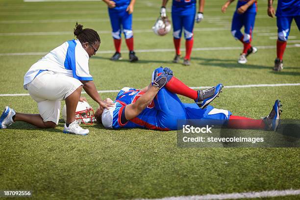 Injured Football Player Stock Photo - Download Image Now - Physical Injury, Sport, American Football - Sport