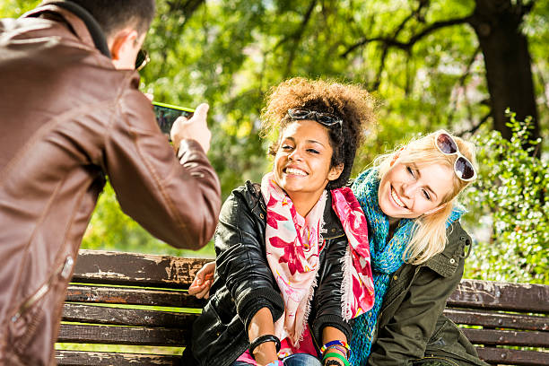 istock Guy taking pictures with a Smartphone 187092564