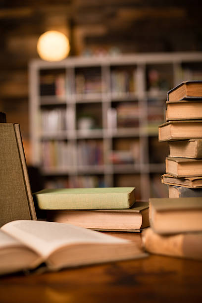 istock Vintage Books Sitting on Old Desk, With Shelved Wall Background 187092702