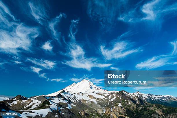 Snowcapped Mount Baker Under High Cirrus Clouds Stock Photo - Download Image Now - Blue, Cascade Range, Cirrus