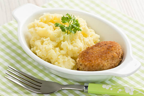 Mashed potato and fishcake stock photo