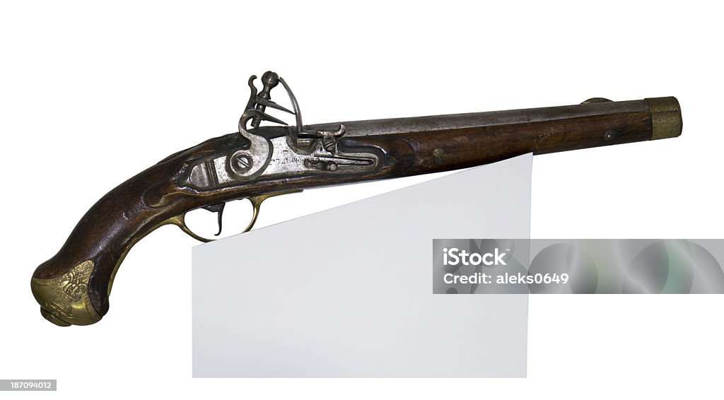 Ancient pistol Ancient pistol-is isolated on the white Ammunition Stock Photo