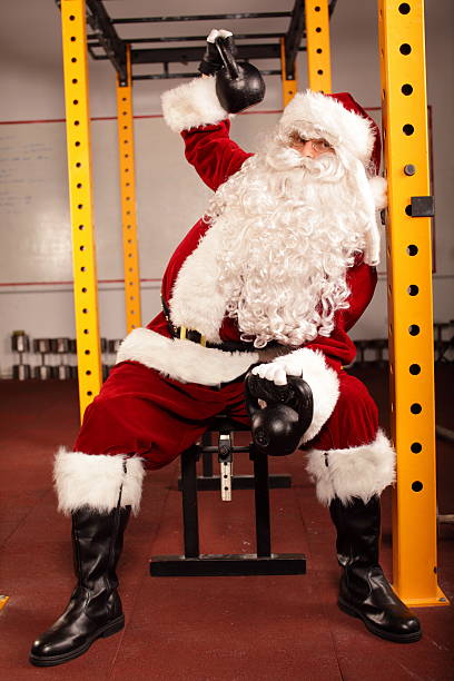 istock Santa Claus training before Christmas with kettlebells on bench 187095846
