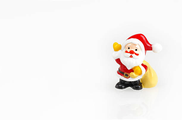 Phot of Santa Claus head shape made of Christmas symbols such as Santa Hat, heart shape, stick candy, and white long beard. Isolated on white. Shot with a full frame mirrorless camera.