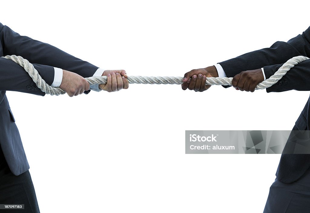 Interracial tug of war Tug of war between caucasian and african descent businessmen Pulling Stock Photo