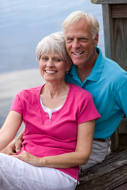 istock Senior Couple Relaxing On Deck 187097898