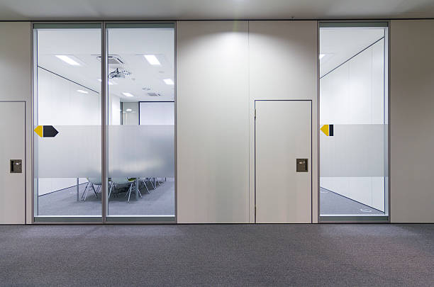 istock Office building hall and door leading into a conference room 187098220