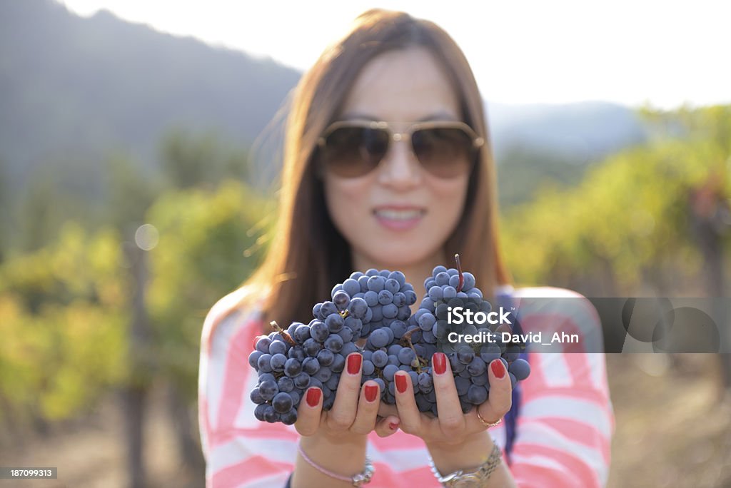 Smiling woman in vineyard Smiling woman in vineyard. Selective focus.  Adult Stock Photo