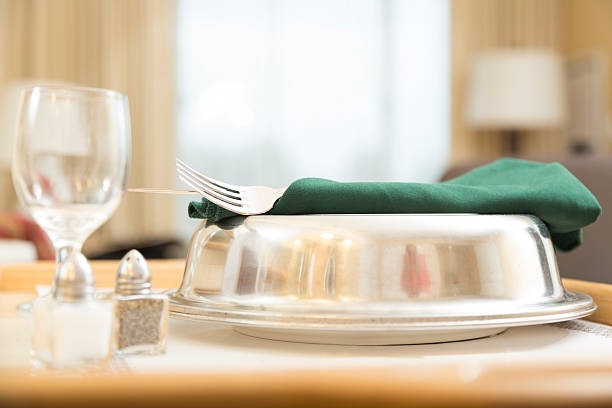 Traveling:  Room service delivered in a hotel suite. Room service delivered to hotel room.  Eye level view of serving tray.  room service stock pictures, royalty-free photos & images