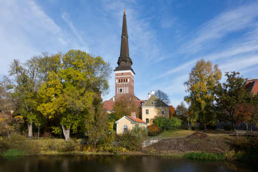 View of the Västerås Cathedral from the Svartan river in a beautiful fall day, Sweden. The Cathedral is originally from the 1200s, 