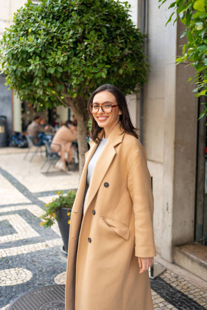 istock Friendly smiling attractive woman leaving building 1871012668