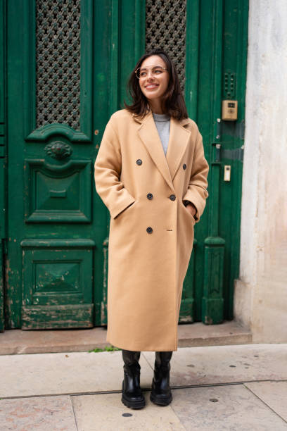 istock Friendly smiling attractive woman leaving building 1871012673