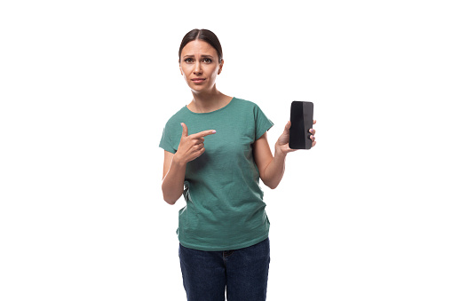 young slim brunette caucasian woman in casual clothes hold smartphone.