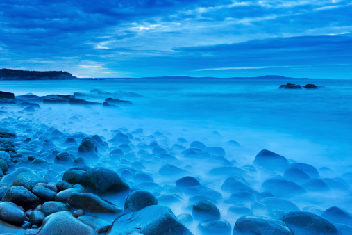 A rocky beach in Acadia National Park, Maine, USA. Photographed during the blue hour before sunrise.