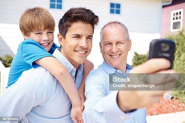 Capturing A Family Moment Stock Photo - Download Image Now - 10-11 Years, 30-39 Years, 50-59 Years