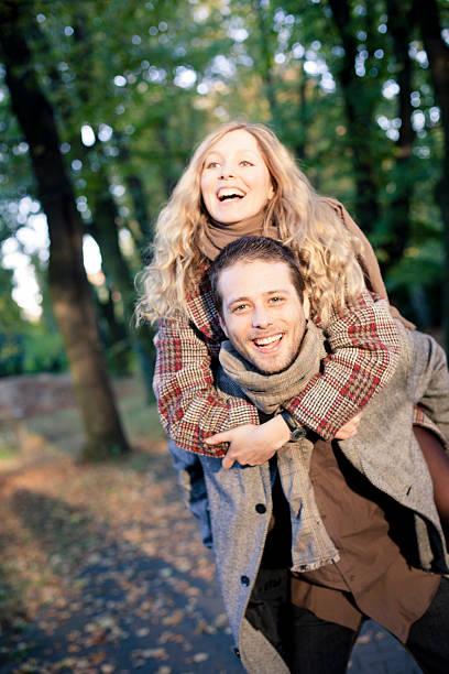 istock young couple in autumn forest 187103104