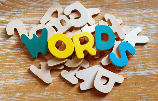 Children's multi coloured wooden alphabets spelling out 'WORDS' 