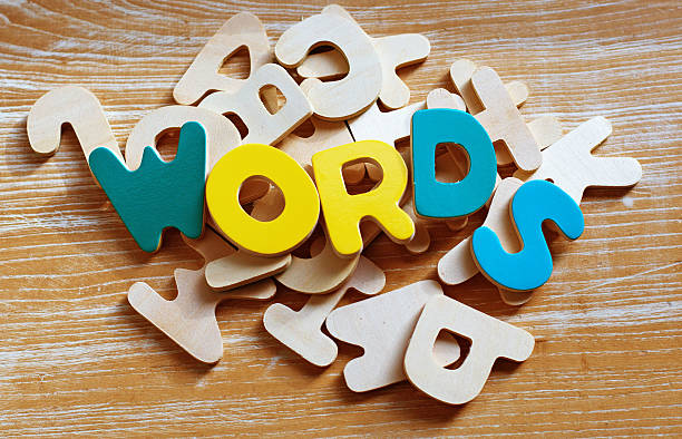 Words are Important Children's multi coloured wooden alphabets spelling out 'WORDS'  spelling bee stock pictures, royalty-free photos & images