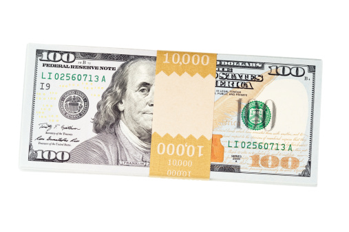The new US $100 bill, issued in October 2013, bundled into a banded stack of $10,000. There is some copy space on the band for your text, logo or concept.