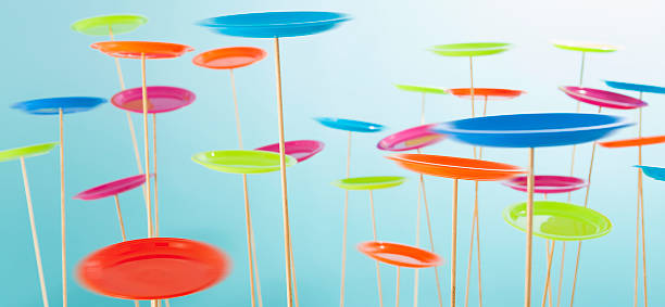 Lots of colorful spinning plates stock photo