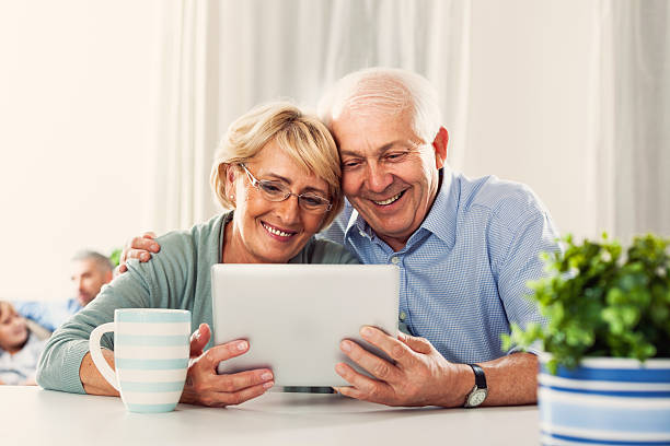 istock Senior couple with digital tablet 187104719
