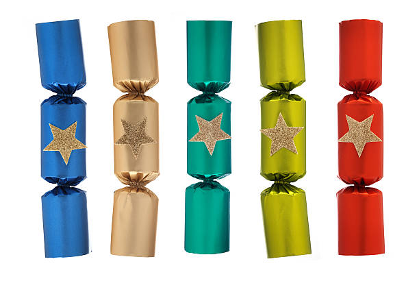 Christmas Crackers Group of Christmas Crackers Isolated on a white. christmas cracker stock pictures, royalty-free photos & images