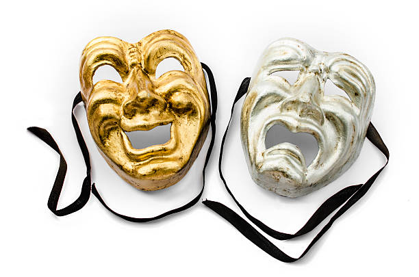 istock A gold and silver theater mask with black ribbons 187105183