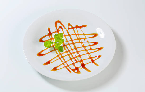 istock Porcelain plate ornated with caramel sauce 187105477