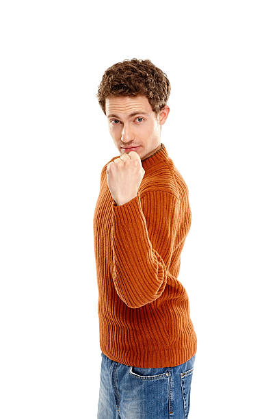 Are you ready to compete Portrait of tough young man showing his fist against white background punching one person shaking fist fist stock pictures, royalty-free photos & images