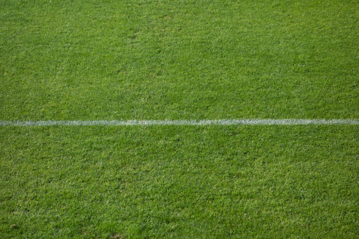 Football (soccer) field corner with white marks   (selective focus)