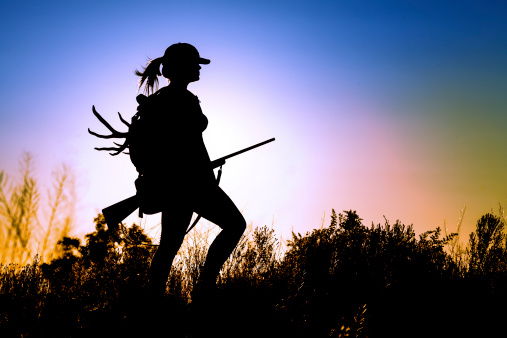 young Lady on a Deer Hunt at sun sunset