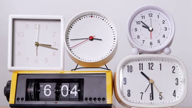 Many time clocks on white background Tell the time at speed, Concept of a lifetime clock.