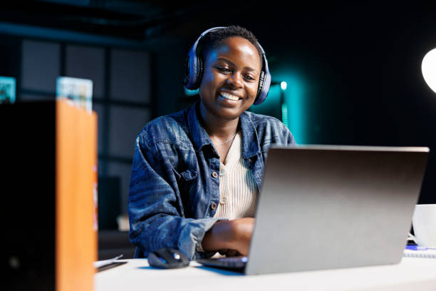 istock Cheerful woman using her digital laptop 1871081097