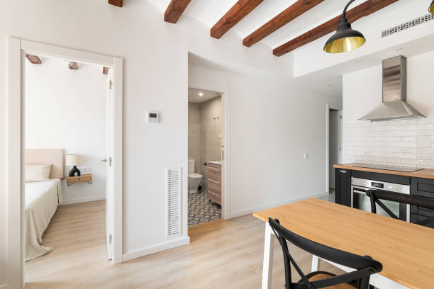 istock Open doors to bedroom and bathroom in studio apartment 1871081637