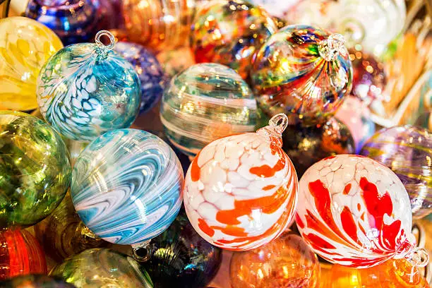 A collection of various glass Christmas ball ornaments.  rr
