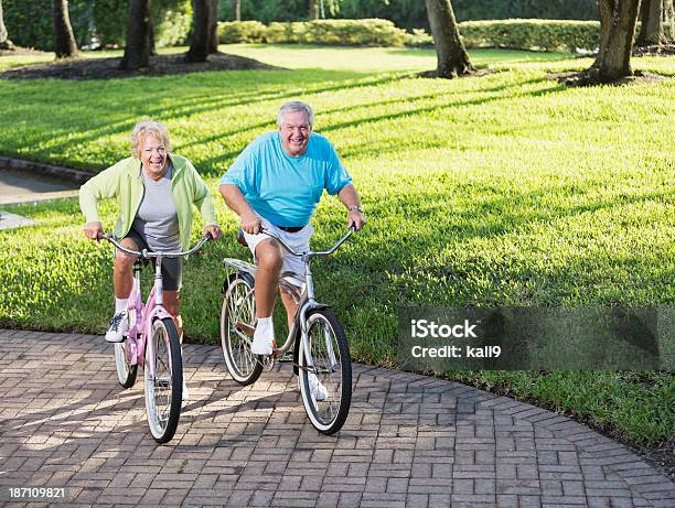 Senior Couple Riding Bicycles Stock Photo - Download Image Now - 60-64 Years, 60-69 Years, 70-79 Years