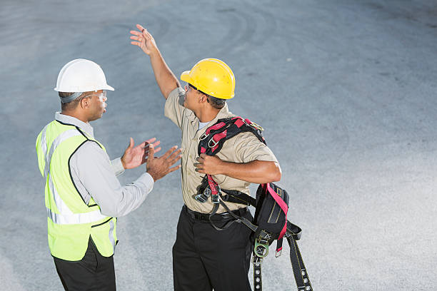istock Workers with hardhats, safety vest and harness 187109833