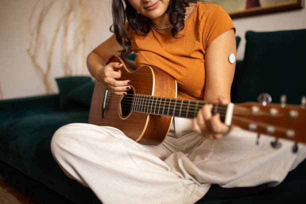 istock Young woman playing guitar 1871103326