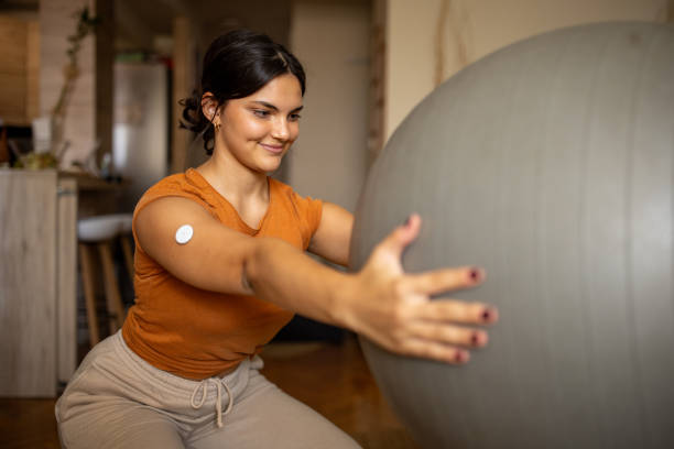 istock Young woman exercising at home 1871113178