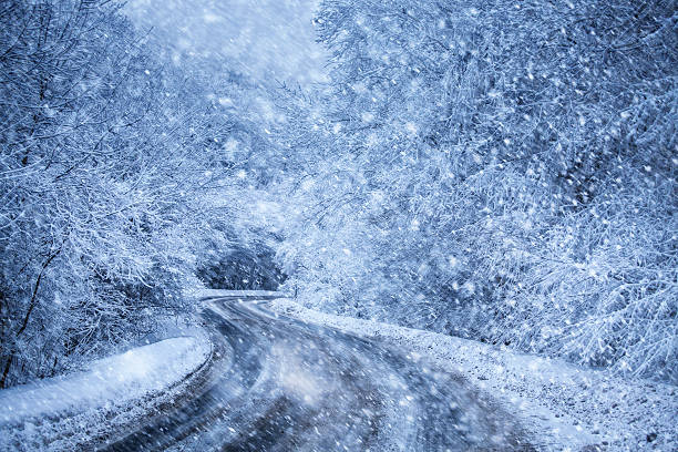 istock highway in the winter forest at snowfall 187111545