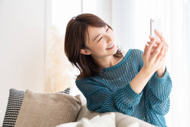 istock Asian woman using a smart phone 1871121450