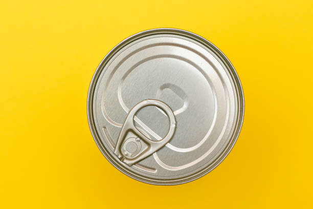 istock Unopened Tin Can with Blank Edge on Yellow Background 1871121995