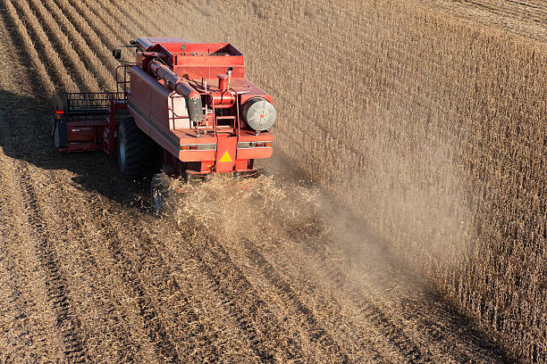 istock Red Combine Harvesting Fall Soybean Field Aerial 187112971