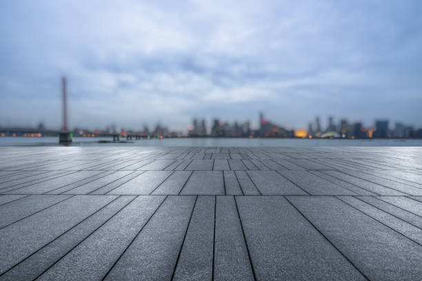 istock night view of empty brick floor front of modern blurred building 1871131084